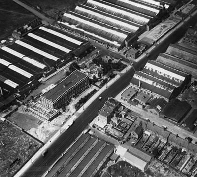 Factories and school building (former AIRCO offices) on the Hyde (Edgware Road), Kingsbury, 1925. This image has been produced from a print.