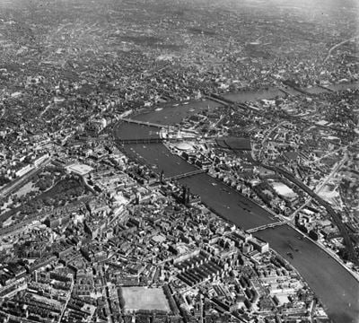 The River Thames running through central London, Westminster, from the south-west, 1951. This image has been produced from a print.