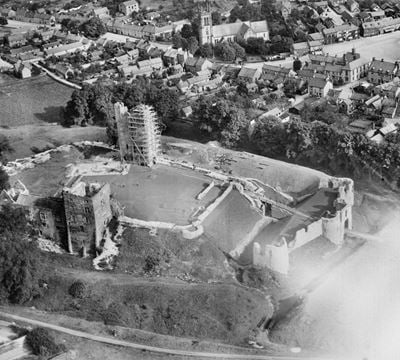 All Saints' Church and the remains of Helmsley Castle with the East Tower undergoing conservation, Helmsley, 1929