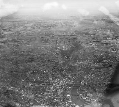 The view over the City and the East End of London towards the Thames Estuary, London, from the west, 1934. This image has been produced from a damaged negative.