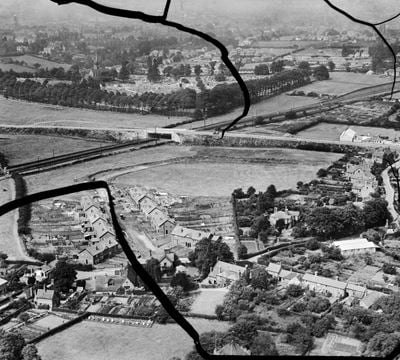 Housing under construction along Meole Crescent, Meole Brace, from the south-west, 1934. This image has been produced from a damaged negative.