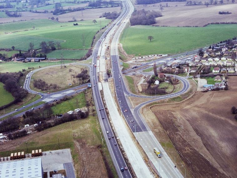 An aerial view looking north towards Junction 6 of the M1, showing road widening work in progress
