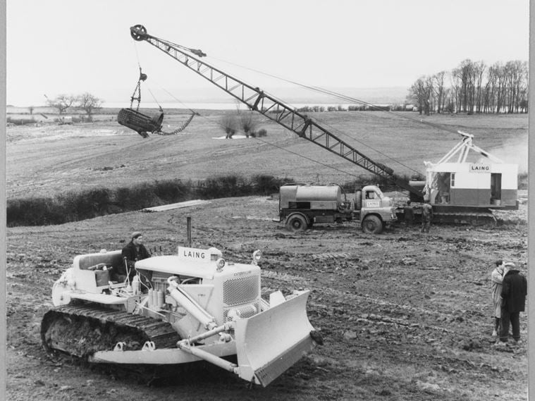 A Lima 802 dragline and a Caterpillar tractor arriving early on site during the construction of Berkeley Nuclear Power Station