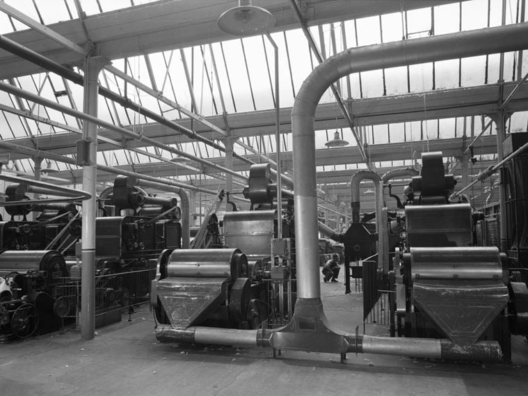 Machinery processing raw fibre in preparation for spinning at the William Hollins and Company Viyella mill works in Pleasley Vale