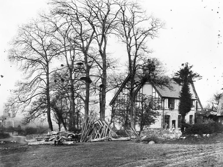 /localA historic photograph of a farmhouse