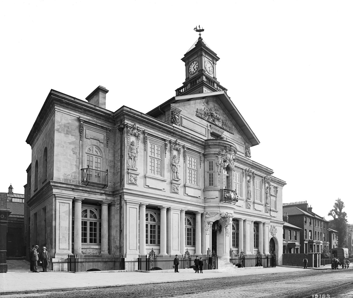 /localA town hall with people walking outside
