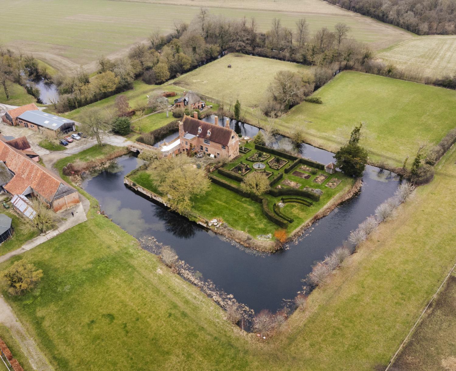 /localAerial view of a moated house