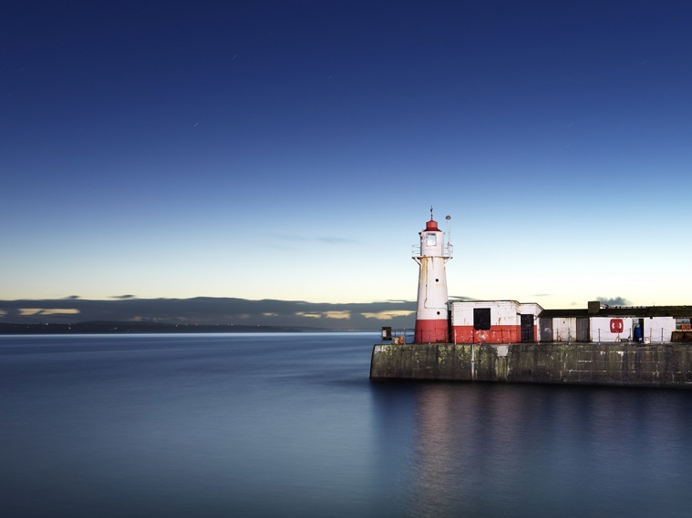A lighthouse in a harbour