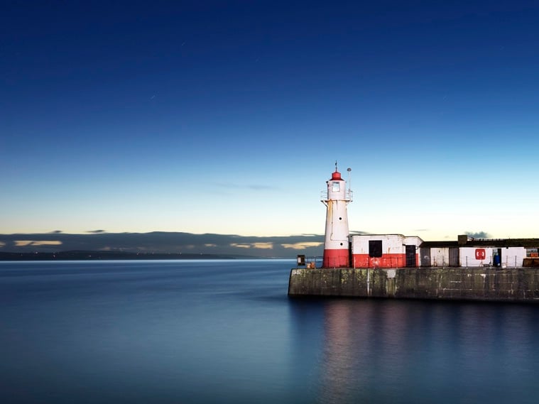 A lighthouse in a harbour