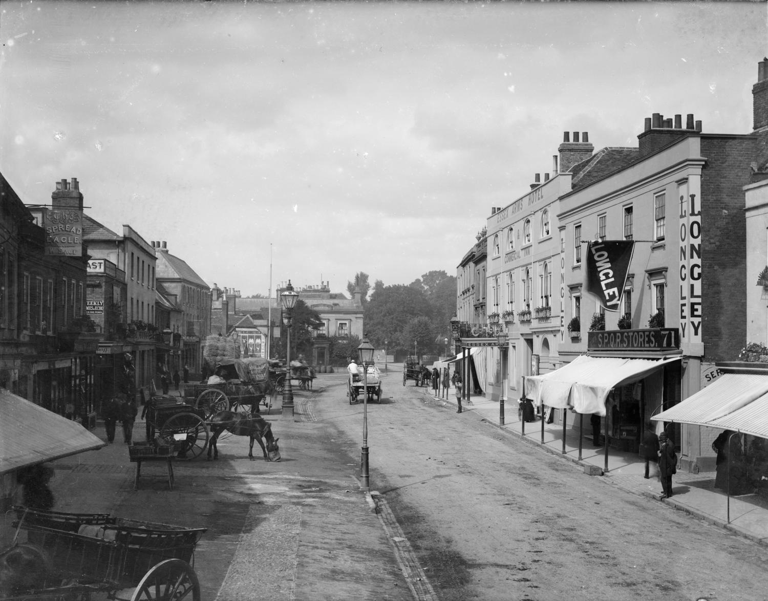 /localA historic street view with shoppers and wagons