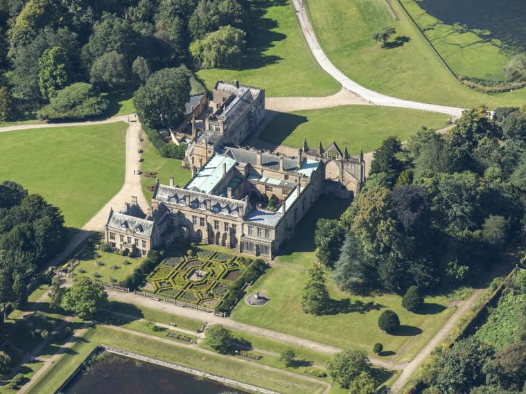 /localAn aerial photo of a manor house and gardens