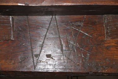 Two V's scribed above an inglenook fireplace