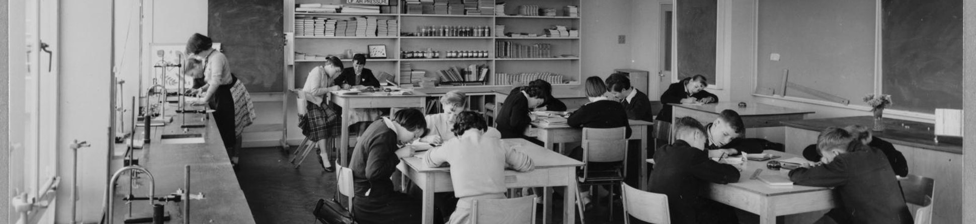 Children at their desks in a science laboratory