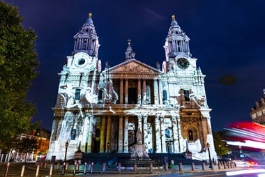 Image of people projected on the west elevation of St Paul's Cathedral.