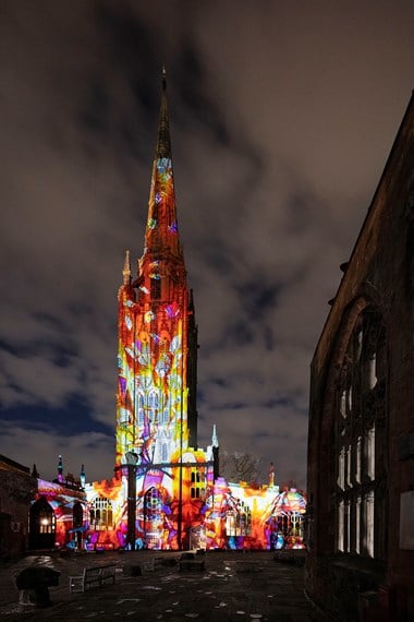 Multi-coloured image projected onto the cathedral building
