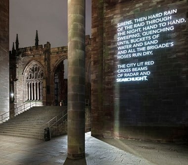 Words from poem projected onto wall of the cathedral