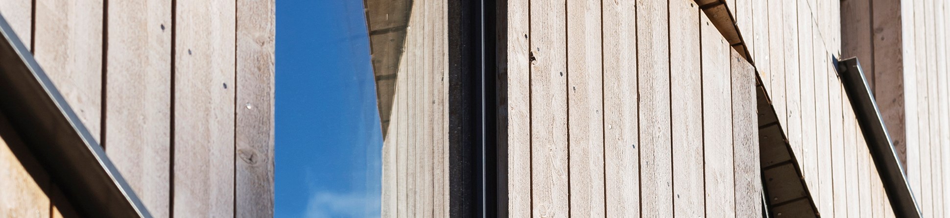 Photo of the rear  of a Victorian semi-detached townhouse with a new timber-clad extension - detail shot