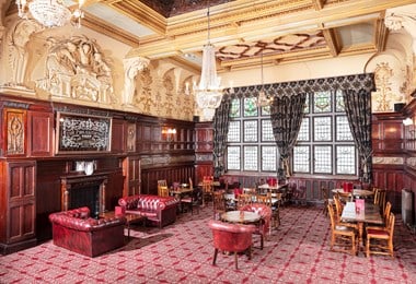 An ornate dining room within a large and imposing Victorian Public House.