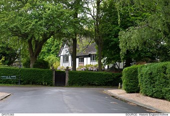 Webb Estate, Woodcote, London showing houses surrounded by high hedges and leafy trees which screen them from the road.