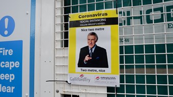A funny health and safety sign. It includes a photo of Bruce Forsyth pointing at the viewer,between an amended version of his catchphrase 'nice two metre. Two metre nice'