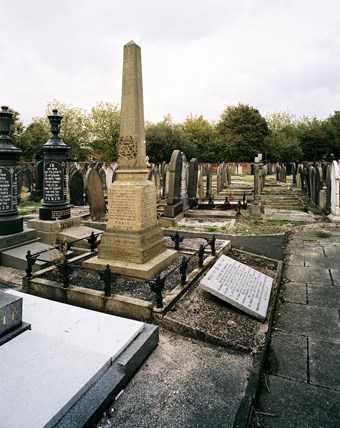 Ornate obelisk and marble slab war memorials in Urmston Jewish Cemetery, Trafford