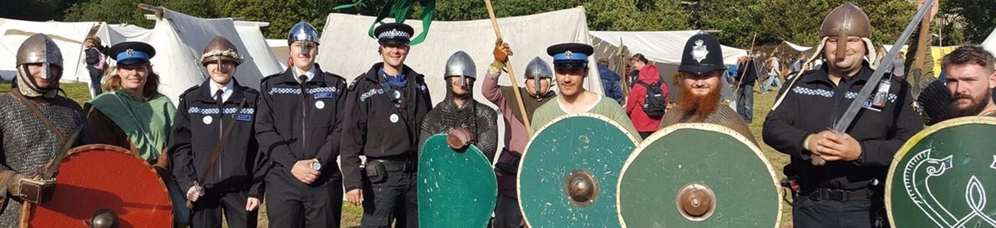 Image of police engaging with a re-enactment group dressed in Anglo-Saxon costume.