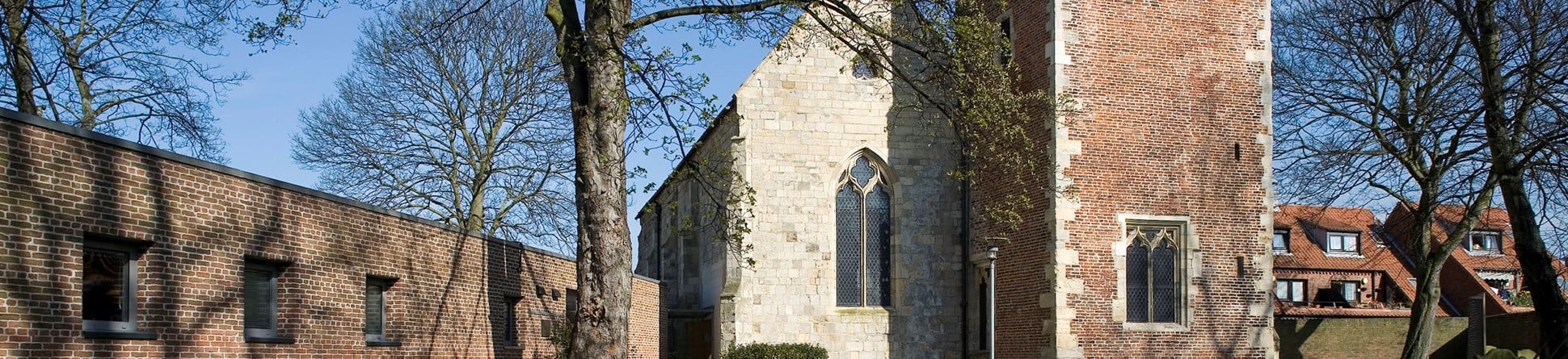 Image of the exterior of the National Centre for Early Music showing the medieval church of St Margaret, Walmgate, and the new extension.