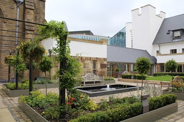 Image showing the Cathedral Court focusing on the garden space and the link corridor to the Cathedral.