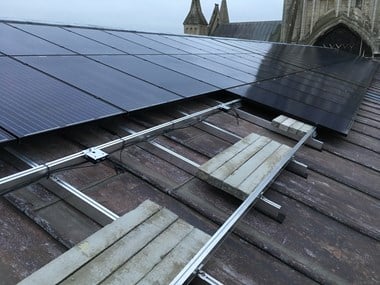 View of the construction of the solar panels on the roof of Gloucester Cathedral.