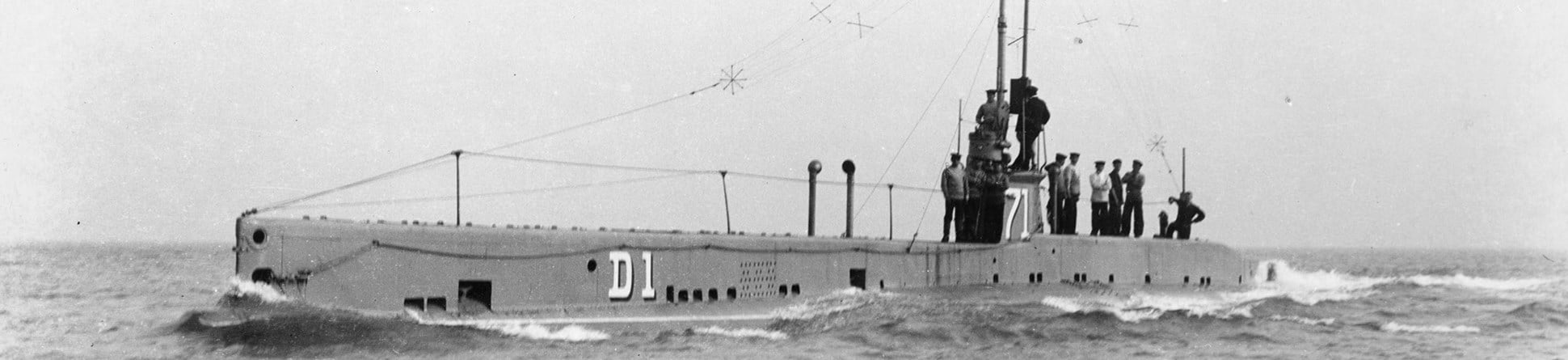 Sailors standing on a submarine at sea