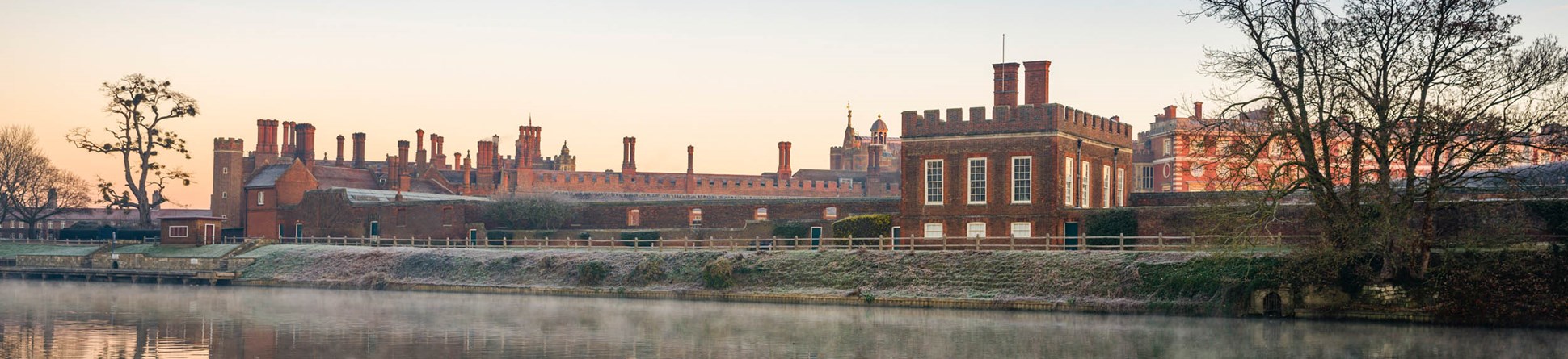 The Banqueting House and Hampton Court Palace with mist rising from the River Thames on a cold morning in the foreground.