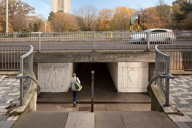 Woman walking into an underpass