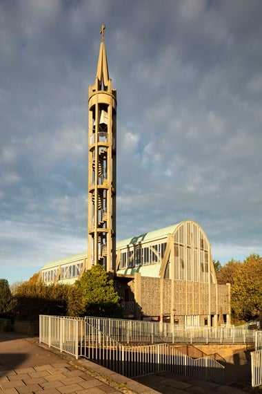 Modern church with open bell tower where the spiral staircase is visible