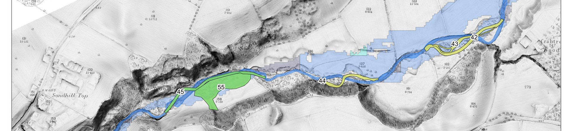 A screenshot of a GIS system with shapes depicting Historic Watercourse Polygons, over historic mapping.