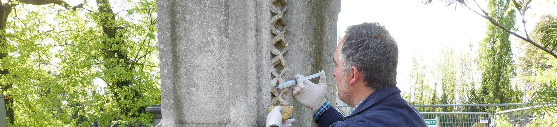 Applying nanolime to a limestone memorial in Kensal Green Cemetery, London