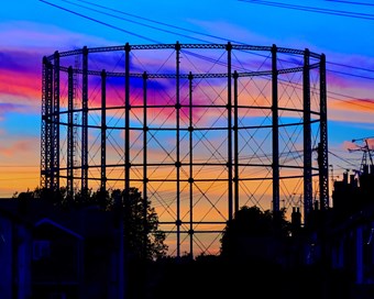 Silhouette of a gas tower