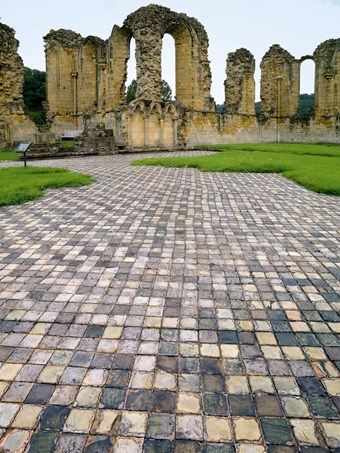 The exposed medieval opus sectile pavement at Byland Abbey, Yorkshire, 12th century.