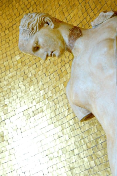 Gold mosaic tiles were used in Virginia Courtauld’s 1930s bathroom at Eltham Palace, London.