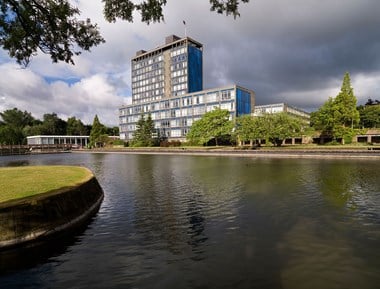 The lake at Alexandra Business Park (St Helens). The lake is the main focal point of the landscape designed by Maxwell Fry for the Pilkington Group headquarters at St Helens. The lake is over 400 metres long and has an average width of 45 metres. The southern half was originally a reservoir for the neighbouring Ravenhead works.