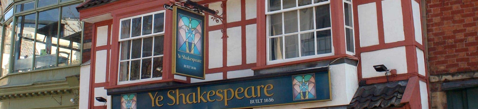 Upward angle street view of the front exterior of 'Ye Shakespeare' public house in Bristol, UK.