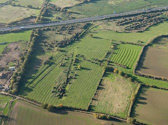 National Filling Factory Banbury, Northampton, aerial photograph showing the earthwork remains of the factory overlying traces of earlier ridge and furrow cultivation.