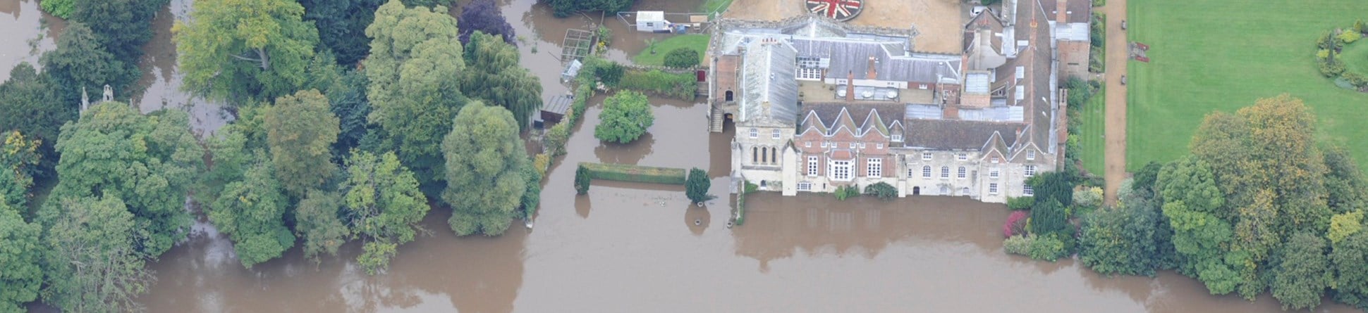Aerial photograph showing the Archbishop of York's palace in Bishopthorpe with floodwater inundating the ground floor.