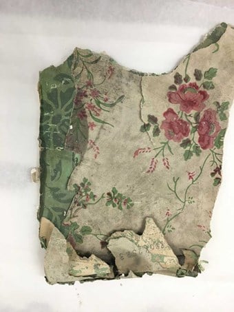 A historic wallpaper featuring a floral pattern. The green pigment used contains arsenic.