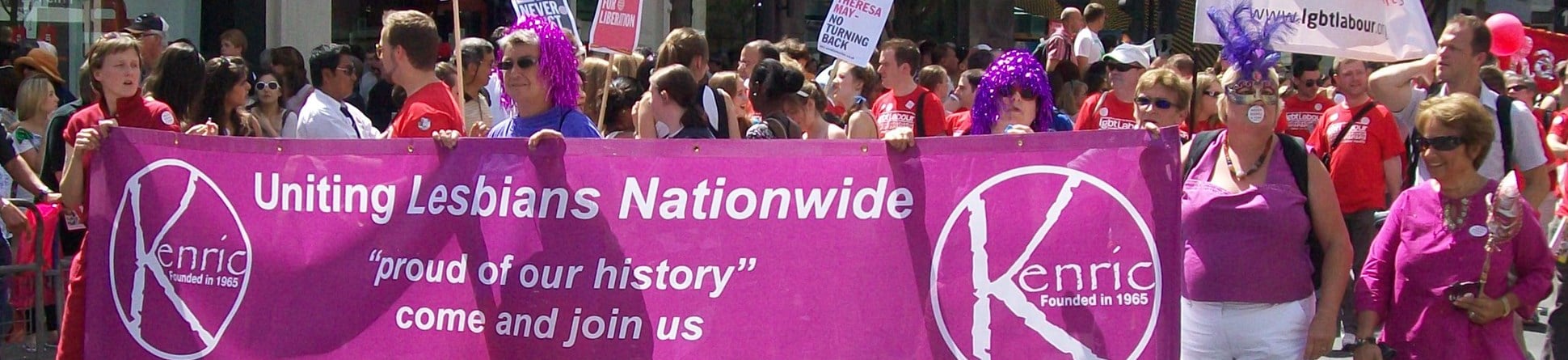 Marchers carrying Kenric banner with wording: 
Uniting Lesbians Nationwide
"proud of our history"
come and join us
www.kenric.org.uk