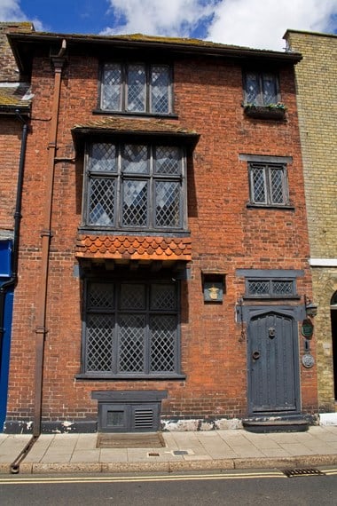 Three storey building with leaded windows