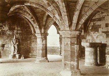 A view of the undercroft of St Leonard's Hospital in York, one of a number of hospitals that closed down as a result of the dissolution of the monasteries by Henry VIII. Photographed by W Maitland (1870-1920)