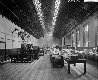Interior of the laundry and ironing room at Claybury Asylum, 1895. Claybury Asylum was built between 1889-1893 to the designs of architect George Thomas Hine. 