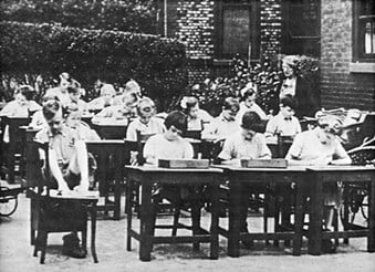 Young people being educated outside the Bethesda Home for Crippled and Incurable Children, c.1910.