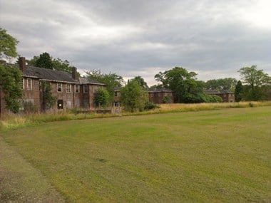 Dilapidated wards and playing field at Harperbury Hospital 2012.