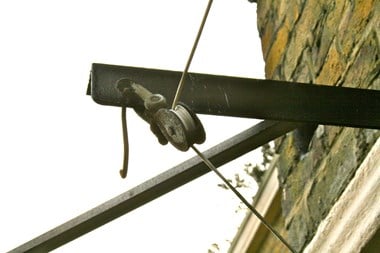 Detail of a washing line on a Lennox House balcony, Hackney. © Cheryl Law (2010). Source Historic England.NMR